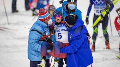 Norwegian athlete ends Winter Olympics campaign after collapsing at biathlon finish line in scary scenes