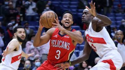McCollum leads hot-shooting Pelicans past Raptors
