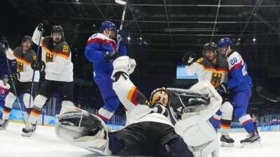 Ice hockey-Germany out, debutants Denmark reach quarter-finals