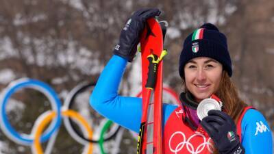 Italy’s Sofia Goggia battles through pain barrier to claim downhill silver