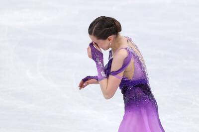 Winter Olympics: Tearful Kamila Valieva cheered as she tops figure skating leaderboard