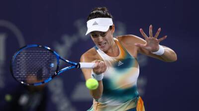 Garbine Muguruza begins Dubai title defence with battling win over Katerina Siniakova