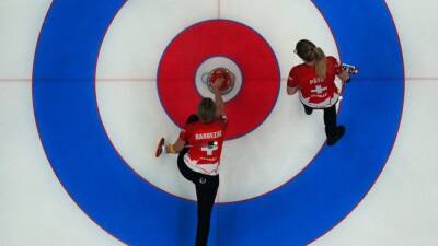 Curling-World champions Switzerland seal spot in women's semi-finals