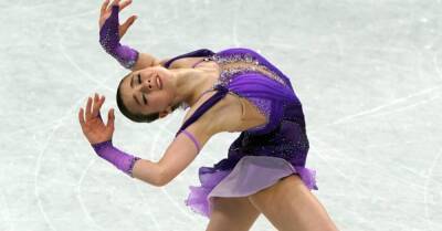 Kamila Valieva leads standings as 15-year-old competes amid cloud of controversy