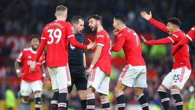 Manchester United charged by FA after surrounding referee Peter Bankes during Brighton win