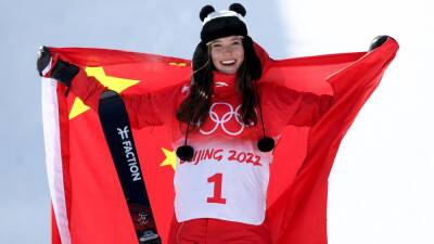 Eileen Gu: Chinese star, 18, makes freeski history at Beijing 2022 with halfpipe gold for third medal of Winter Olympics