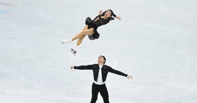 Home hopes Sui Wenjing and Han Cong set new world record to lead after pair skating short program