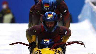 Bobsleigh-German team piloted by Friedrich takes gold in four-man