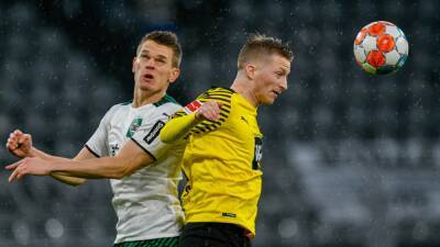 Marcos Reus inspires Borussia Dortmund to crush Borussia Monchengladbach to stay in Bundesliga hunt