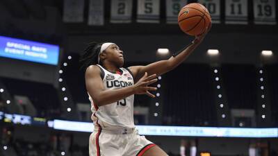 Williams leads No. 10 UConn to 90-49 rout of Georgetown