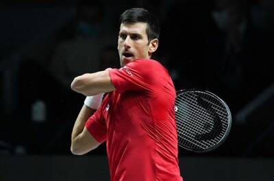 Djokovic finally gets season under way to loud cheers in Dubai