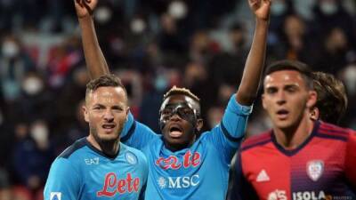 Christian Radnedge - Peter Hall - David Ospina - Late Osimhen header earns title-chasing Napoli draw at Cagliari - channelnewsasia.com - Italy - Nigeria