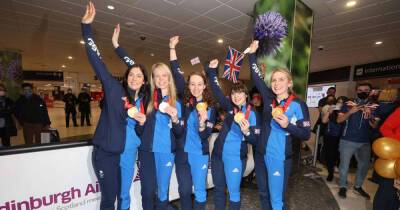 Olympics Curling Teams land at Edinburgh Airport after winning two medals at the Beijing Games