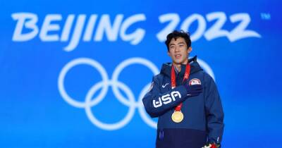 Nathan Chen places gold medal around mother's neck at surprise reunion