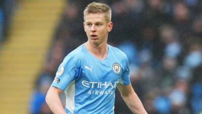 Ukraine conflict: Manchester City Oleksandr Zinchenko joins vigil in Manchester city centre