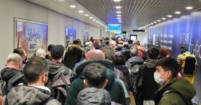 Pictures show chaos at Manchester Airport as passengers complain of 'mile long queues'