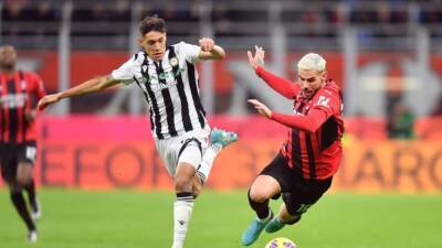 Milan held at home by Udinese but maintain lead at top of the table