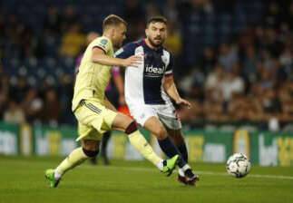 Luton Town defender reacts to Robert Snodgrass signing