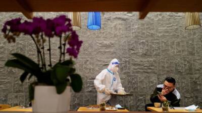 Cocktails and hazmat suits mingle in the Beijing Olympics bubble - channelnewsasia.com - France - China - Beijing