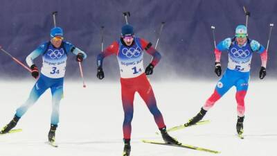 Biathlon-Blustery winds and shooting woes level the field