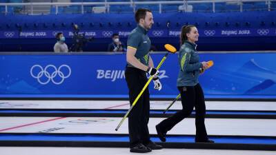 John Morris - Aussies curlers out of Olympics after positive COVID test, back in, then win 1st game - foxnews.com - Switzerland - Australia - Canada - Beijing - county Martin