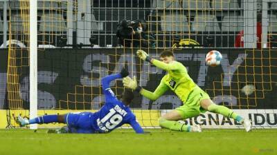 Dortmund's title hopes fade further with heavy home defeat