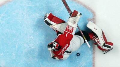 China upset rivals Japan in tense ice hockey shootout, US best Swiss