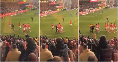 Brennan Johnson - Philip Zinckernagel - Joe Worrall - Leicester 'fan' invades pitch and attacks Nottingham Forest players after goal - givemesport.com -  Leicester - county Forest -  Huddersfield