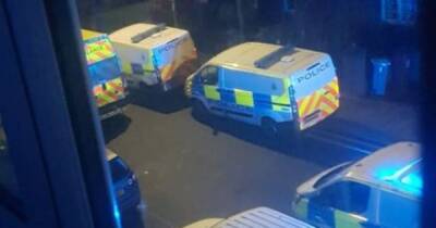 LIVE: Huge police presence as road taped off amid reports of 'loud bang' - manchestereveningnews.co.uk - Manchester