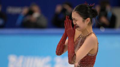 Olympic US-born Chinese figure skater Zhu Yi breaks down in tears after falling again during team event