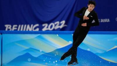 Nathan Chen - Nathan Chen scores world-record 113.97 points in short program at Beijing Olympics - espn.com - Usa - Beijing - Japan