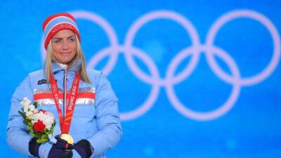 Cross-country skiing-Johaug wary of chasing pack as gold hunt resumes