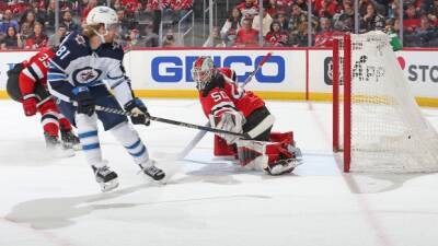 Connor scores 35th to help Jets edge Devils