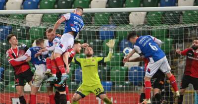 Linfield 3 Crusaders 2: Devine intervention as Blues snatch crucial victory at Windsor
