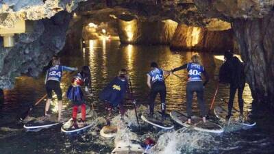 Europe's biggest underground lake hosts stand up paddle board race