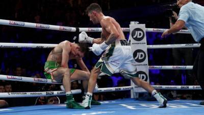Eddie Hearn - Michael Conlan - Leigh Wood knocks out Michael Conlan in 12th round to retain WBA featherweight title - espn.com - China - Ireland -  Belfast