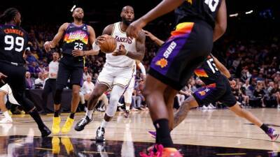 Lakers' LeBron James becomes first player in NBA history to reach 10,000 points, rebounds, assists