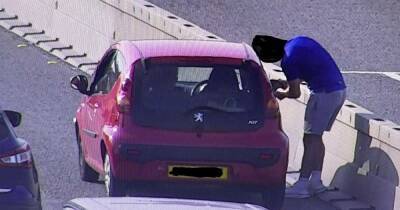 Moment driver got out of his car in middle of M6 to adjust his wing mirror
