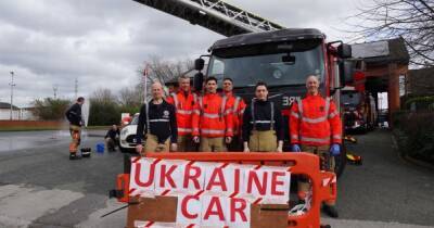 Firefighters wash cars to raise thousands for Ukraine effort
