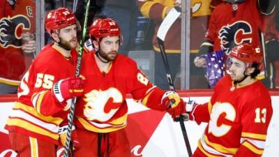 Flames power past Devils behind balanced high-scoring effort