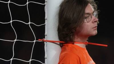 Boris Johnson - Christian Radnedge - Oil protestor ties himself to goal post at Premier League fixture - channelnewsasia.com - Britain - Saudi Arabia