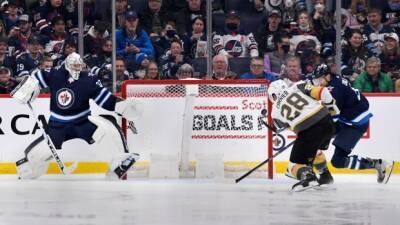 Hellebuyck's big night helps Oilers hold playoff gap over Golden Knights