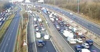 LIVE: M60 traffic held with long queues after crash involving 'van and two cars'