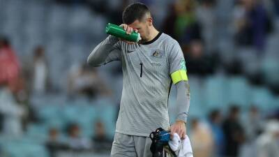 Socceroos' automatic World Cup qualification hopes dashed in 2-0 loss to Japan in Sydney