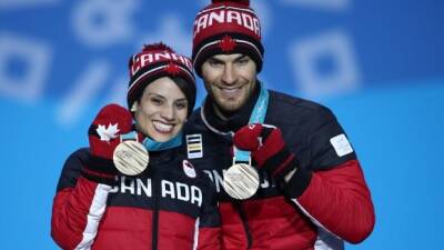 Isu - Skating union replaces commentators, apologizes for vulgar comment aimed at Canada's Duhamel - cbc.ca - Britain - Russia - Ukraine - Canada