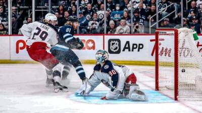 Jets top Blue Jackets in overtime after squandering lead with 14 seconds left - cbc.ca - county Centre -  Columbus - county Logan - county Stanley