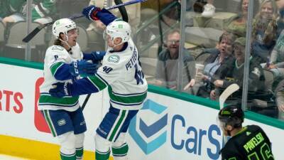 Pettersson registers 200th career point as Canucks rally past Stars