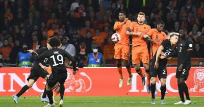 Soccer-Netherlands snap Germany's winning streak with 1-1 draw