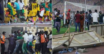 Furious Nigeria fans STORM pitch after missing out on Qatar World Cup