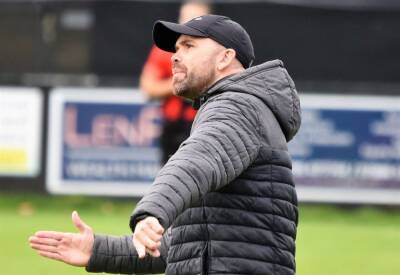 Sittingbourne manager Darren Blackburn paying his players' yellow card fines